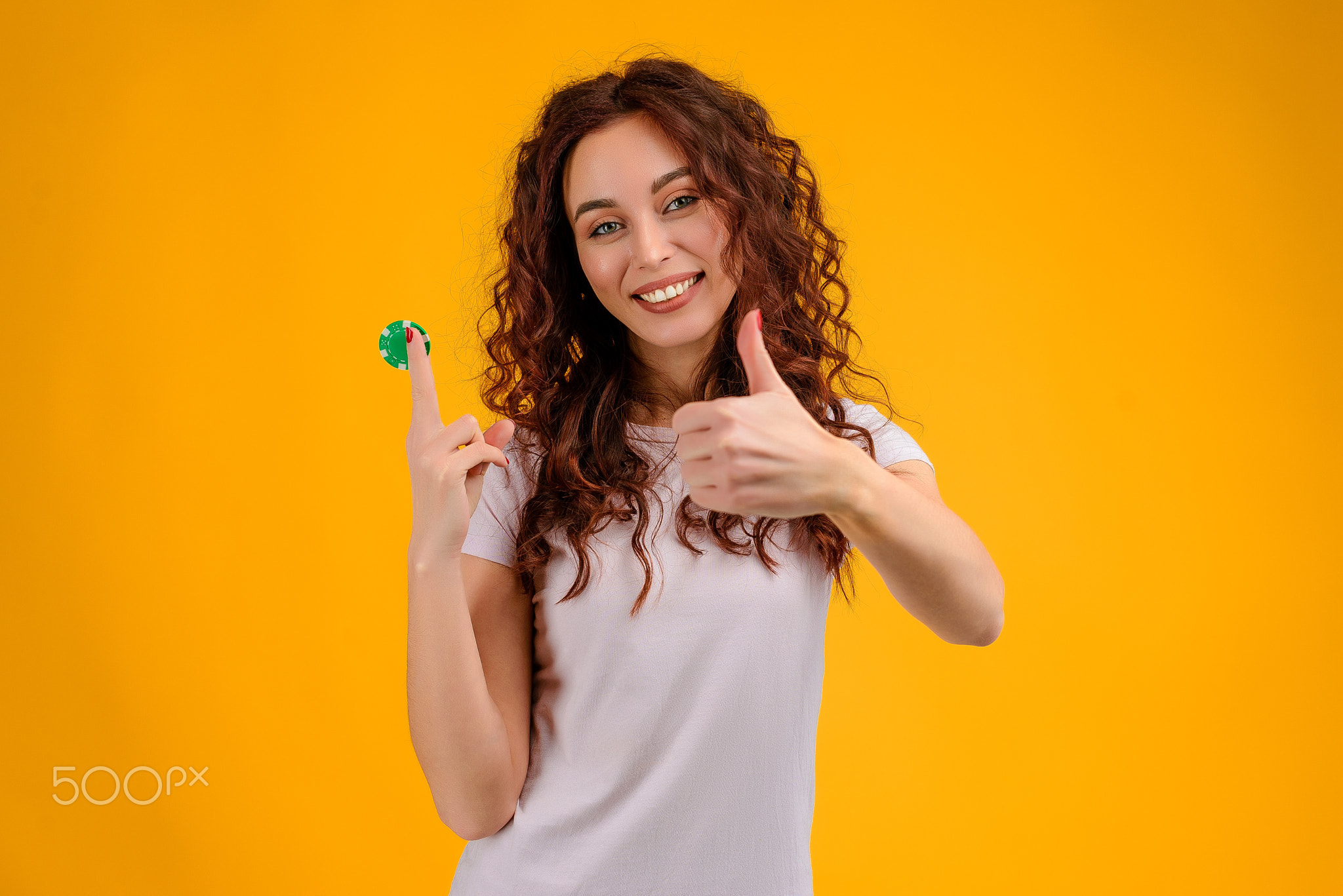 Young woman with curly hair isolated over bright colorful background