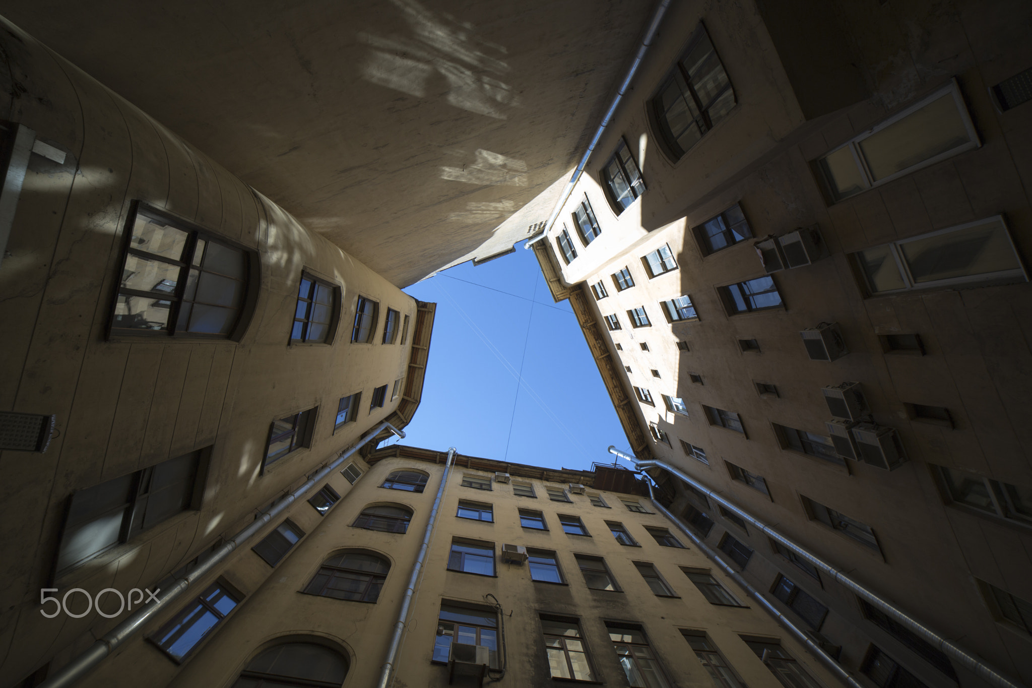 In the courtyard of the well house.