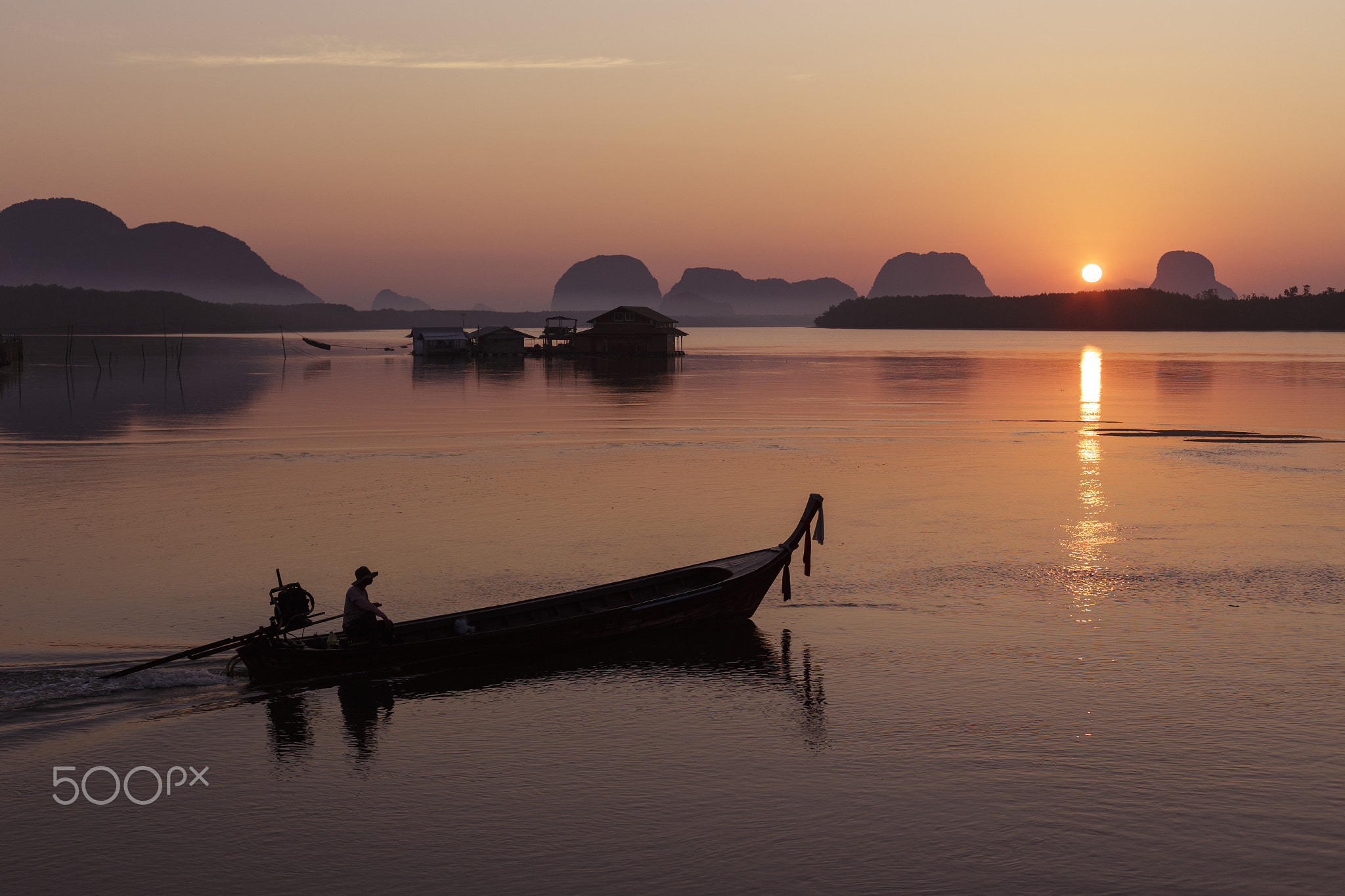 Morning sun with fishing boat