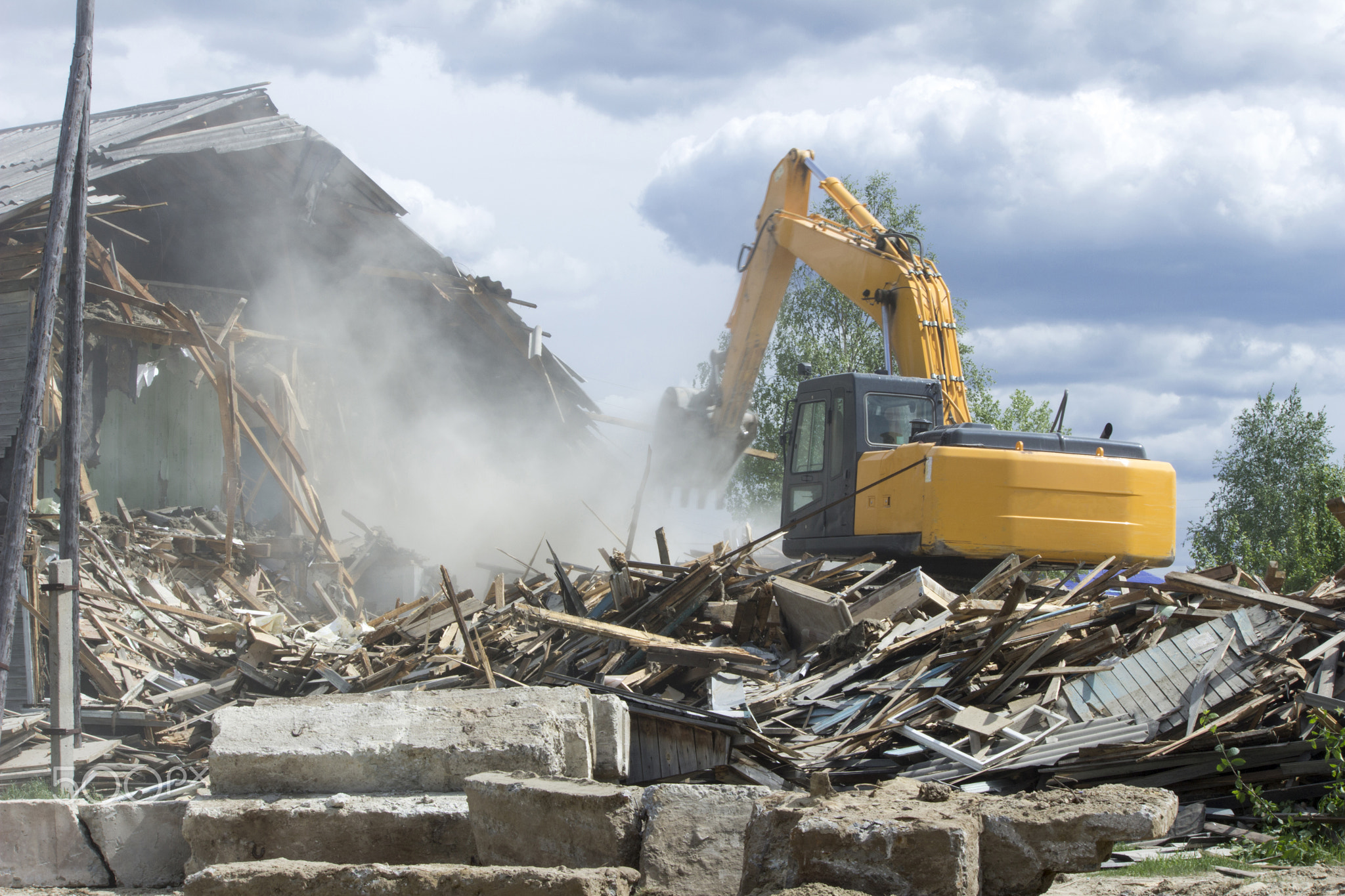 The demolition of the old wooden house