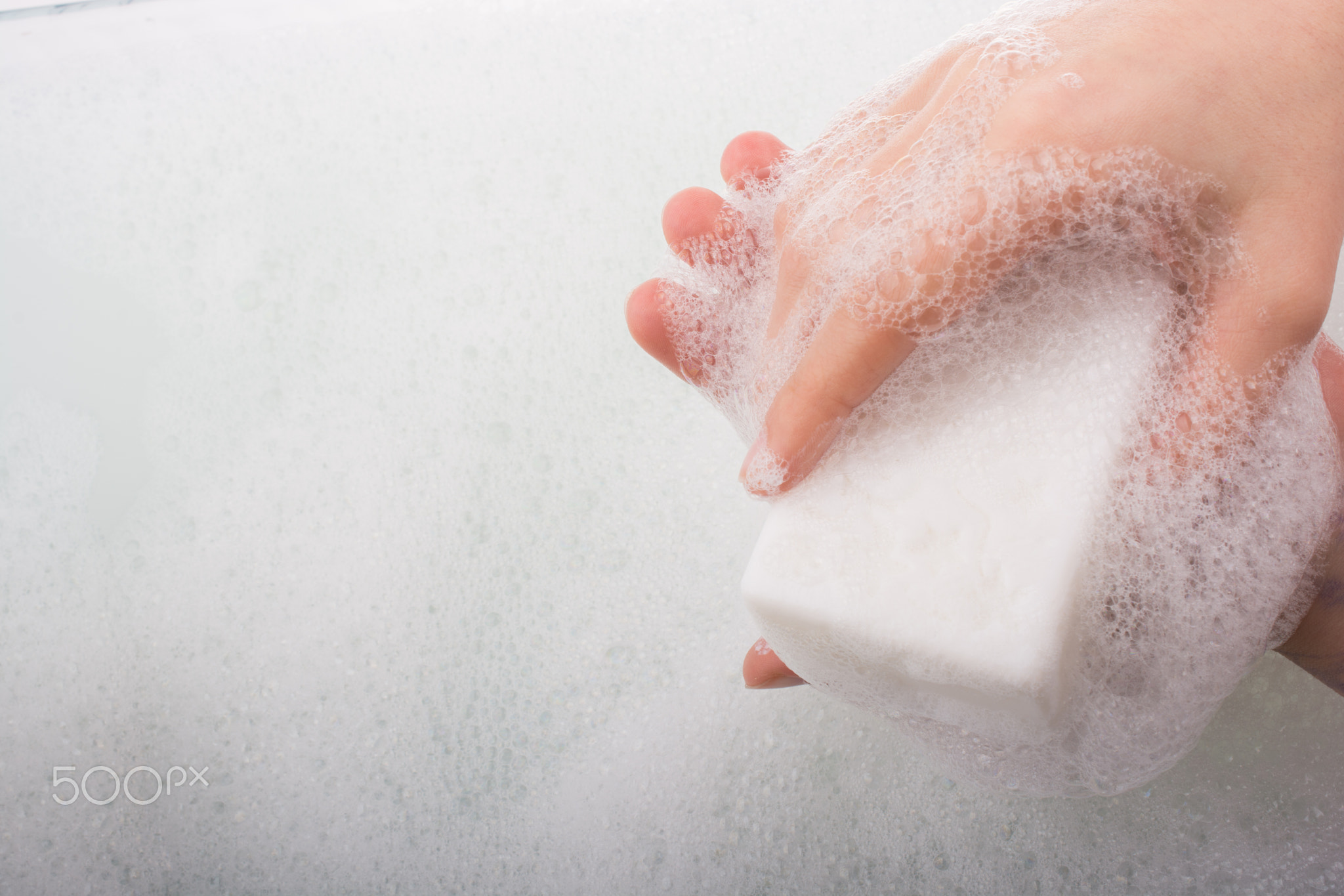 Child washing hands with soap