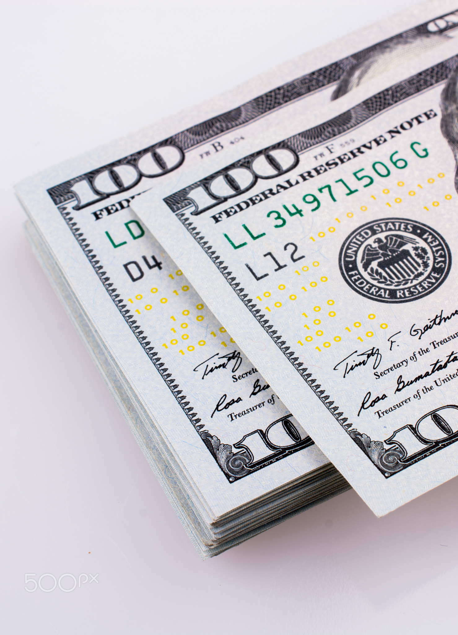 American 100 dollar banknotes placed on white background