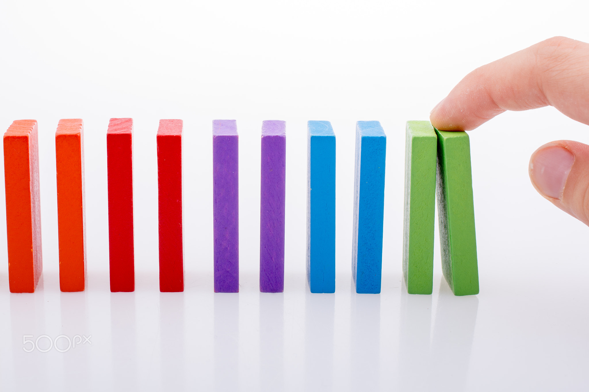 Hand holding color dominoes