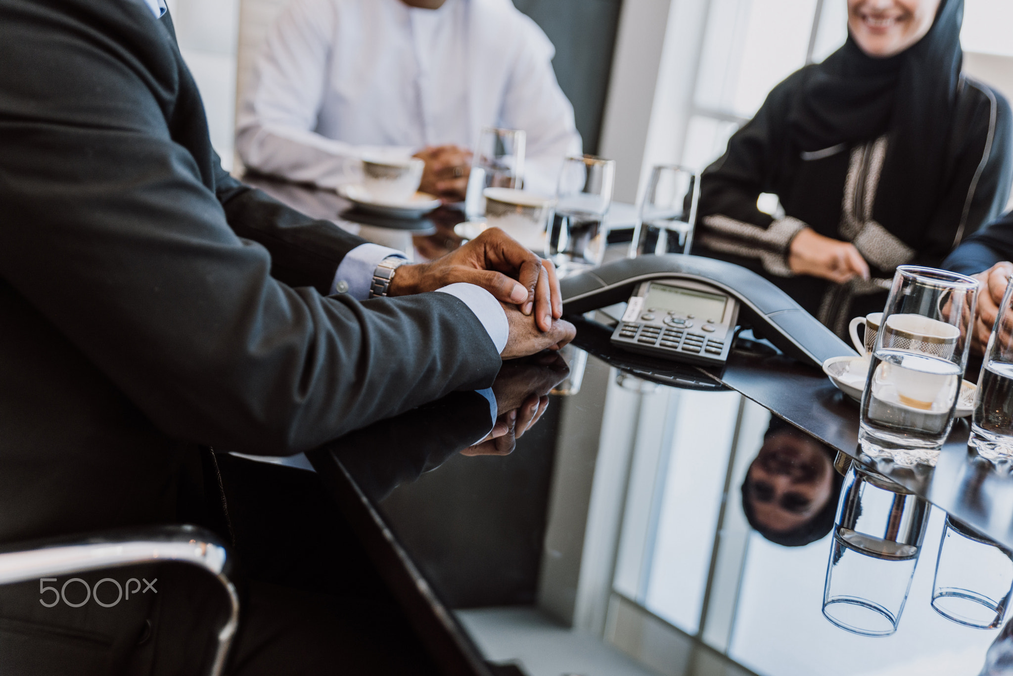 Mixed business team making agreements on future business plans.