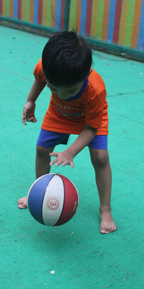 kid playing basketball funday