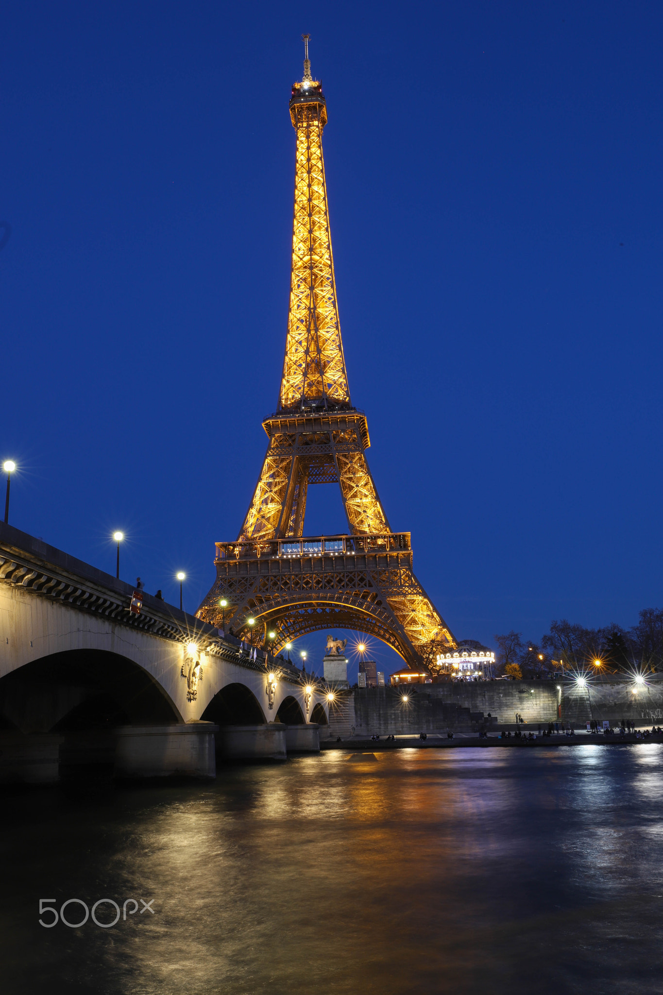 The Eiffel Tower Tour Eiffel illuminated at night, Paris, France.