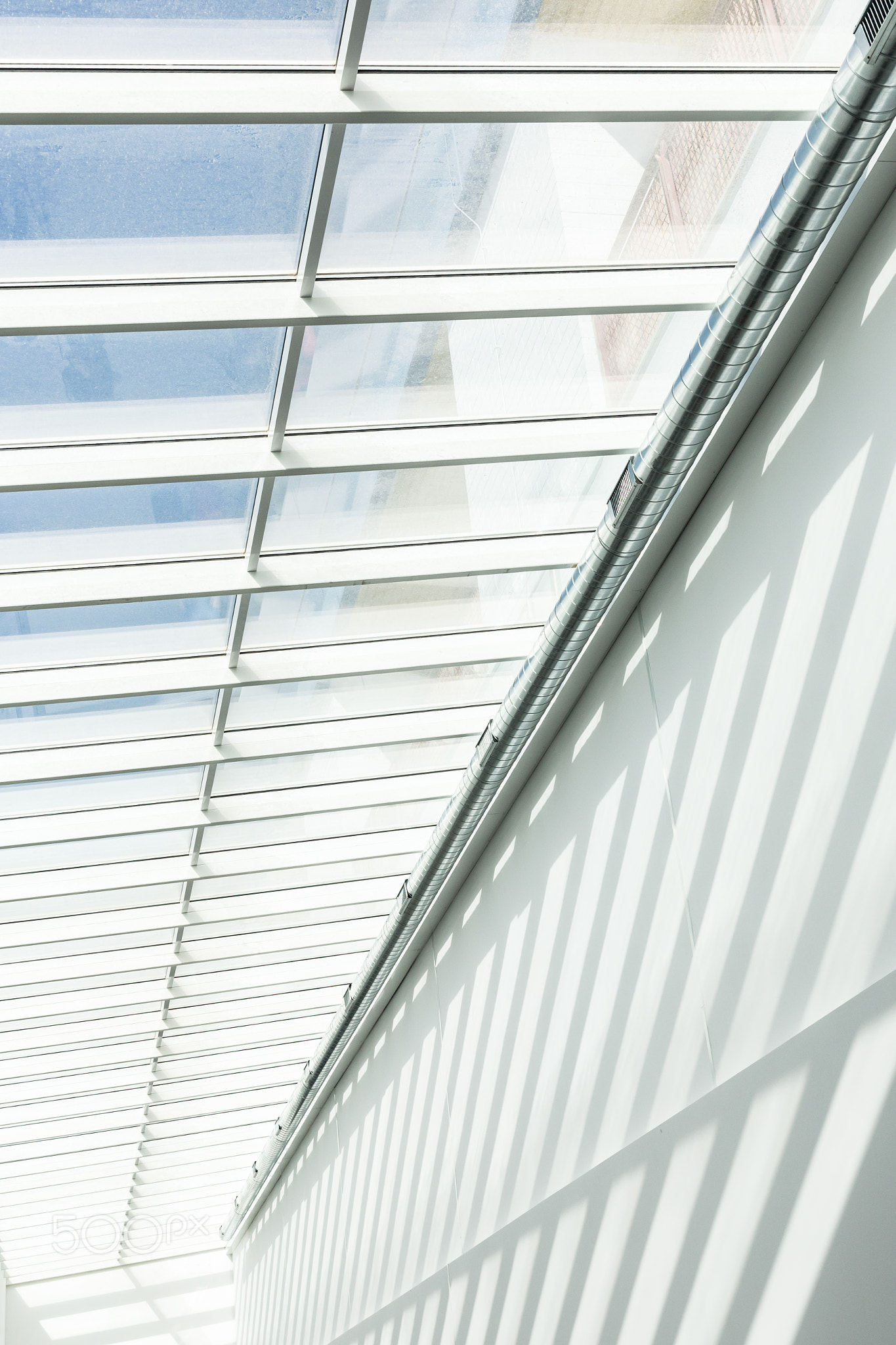 Geometric shapes and patterns in contemporary architecture. Shadow on the white wall.