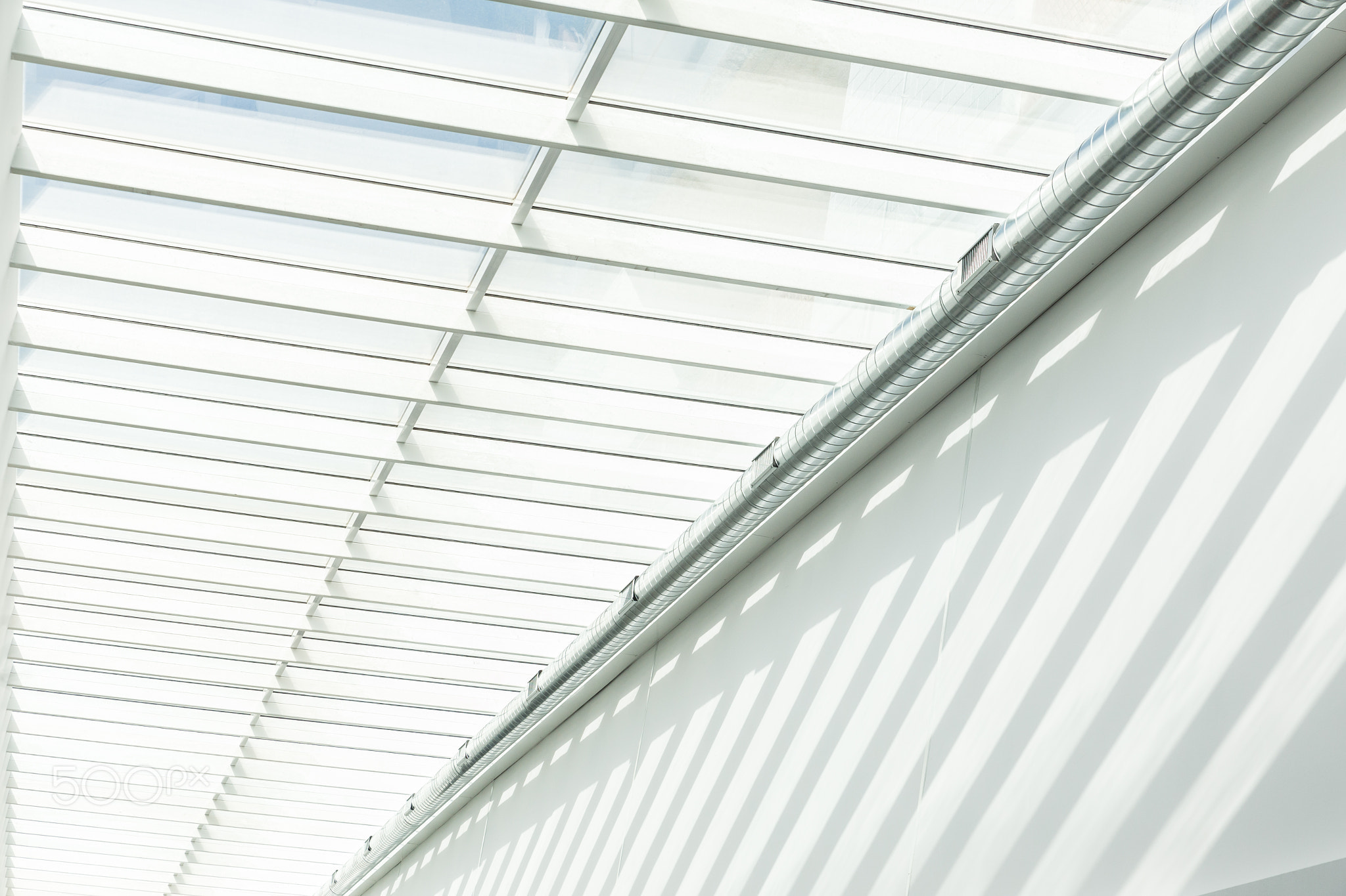 Geometric shapes and patterns in contemporary architecture. Shadow on the white wall.