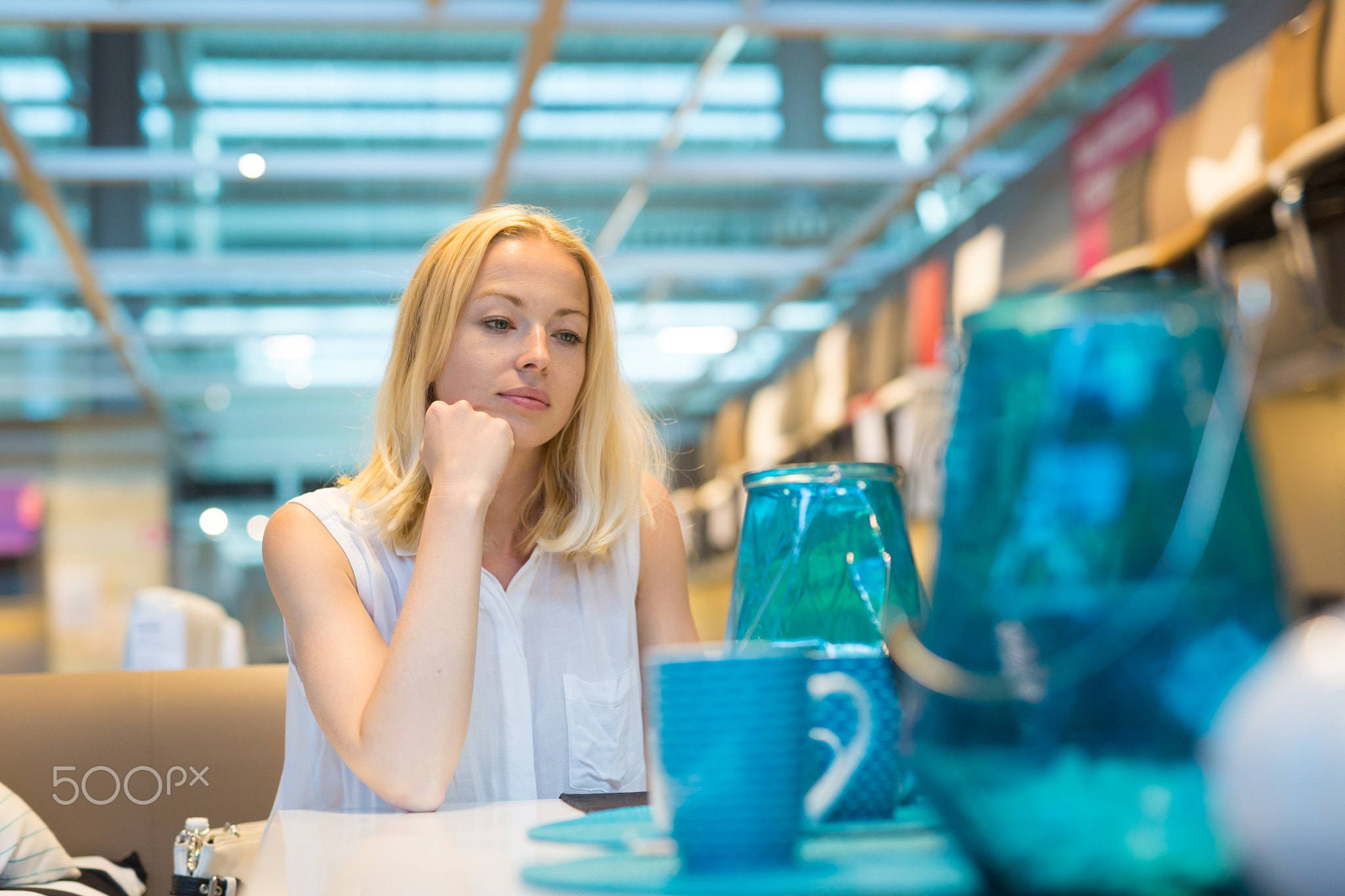 Beautiful young woman shopping in retail store.