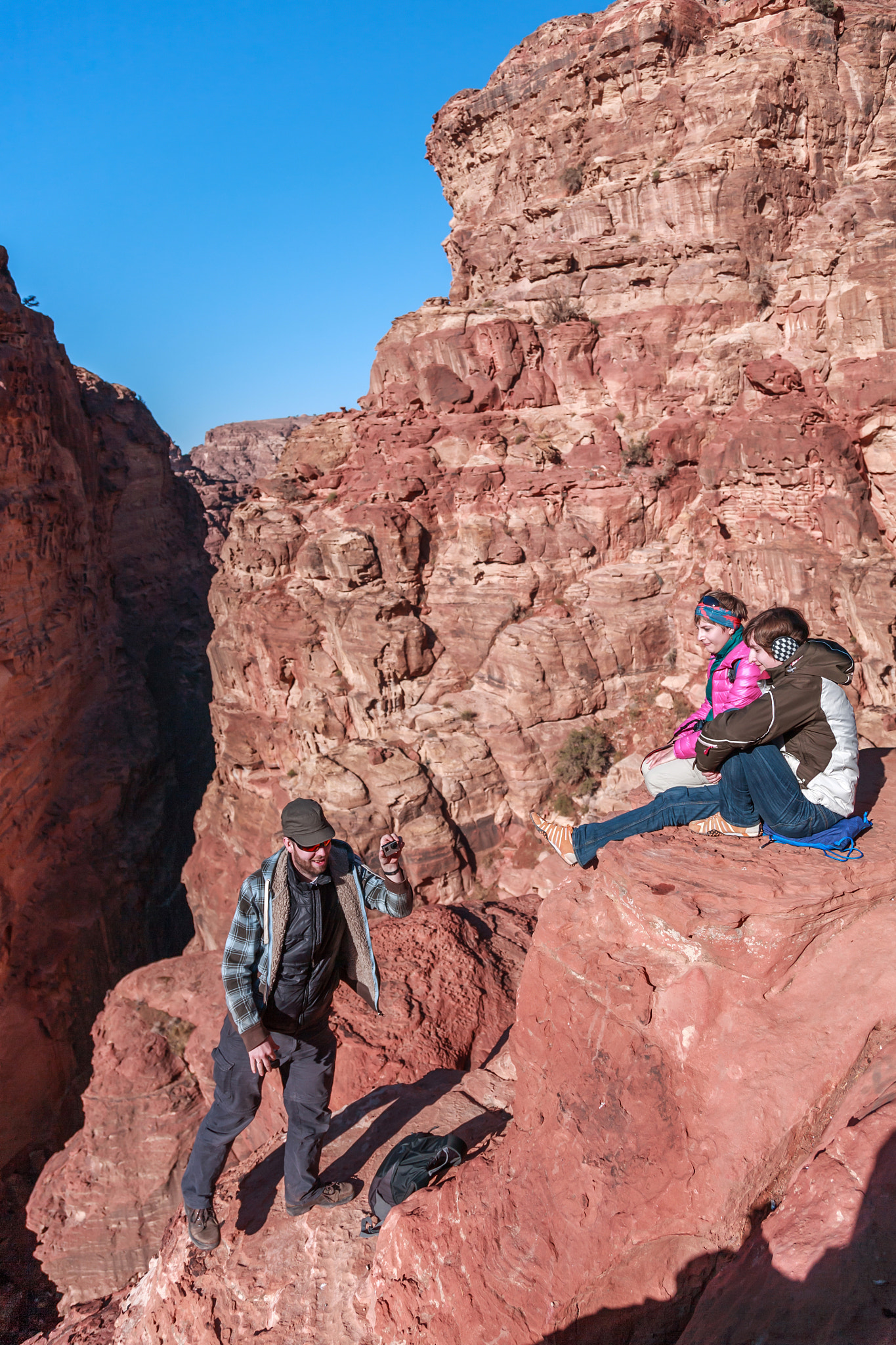 A man balancing on the edge of a canyon