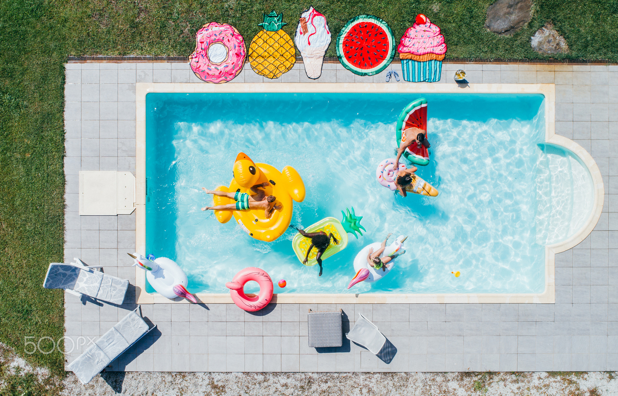 group of friends having fun in the swimming pool