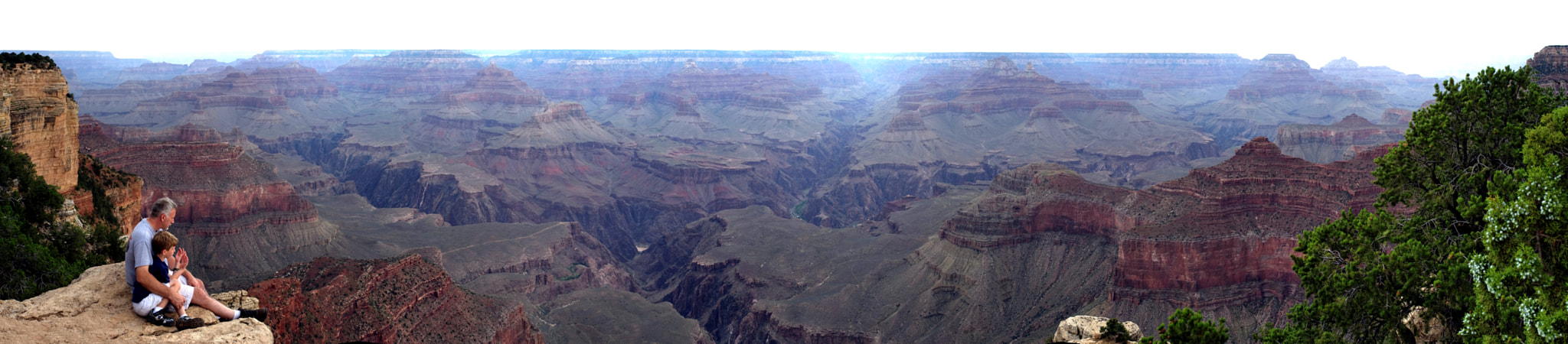 A grand father and his little son over the Grand Canyon - Panorama Version