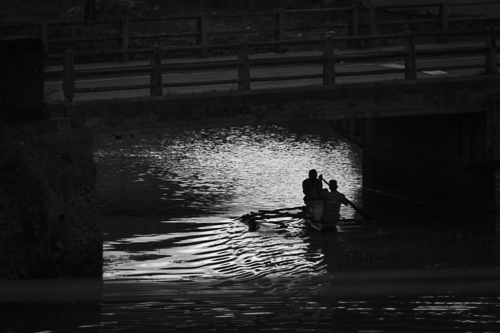 Canoe Passes Under a Canal Bridge, Colombo by Son of the Morning Light on 500px.com