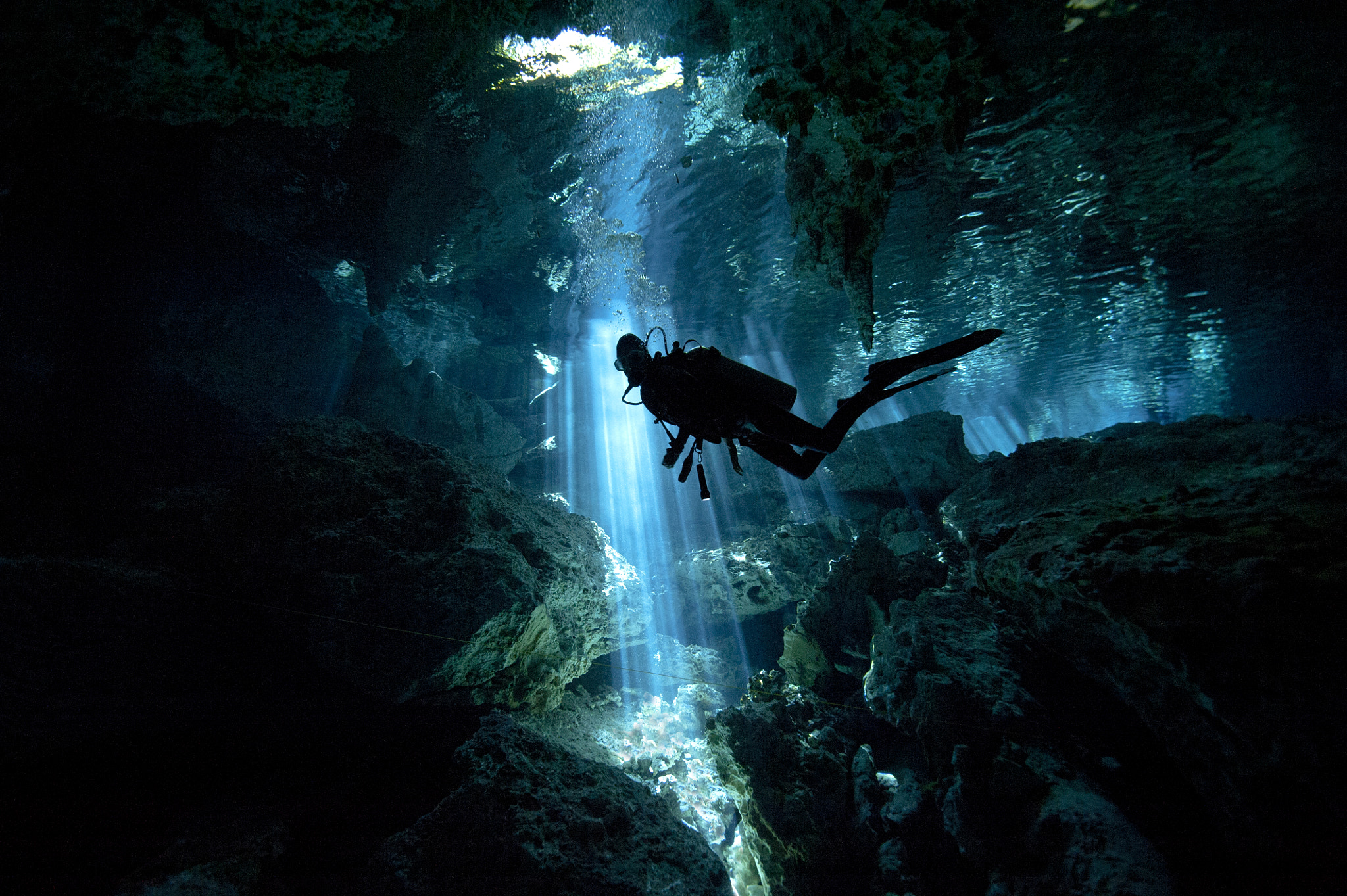 Lights rays in an underwater cave by Brian Heinrichs Photo 48849894
