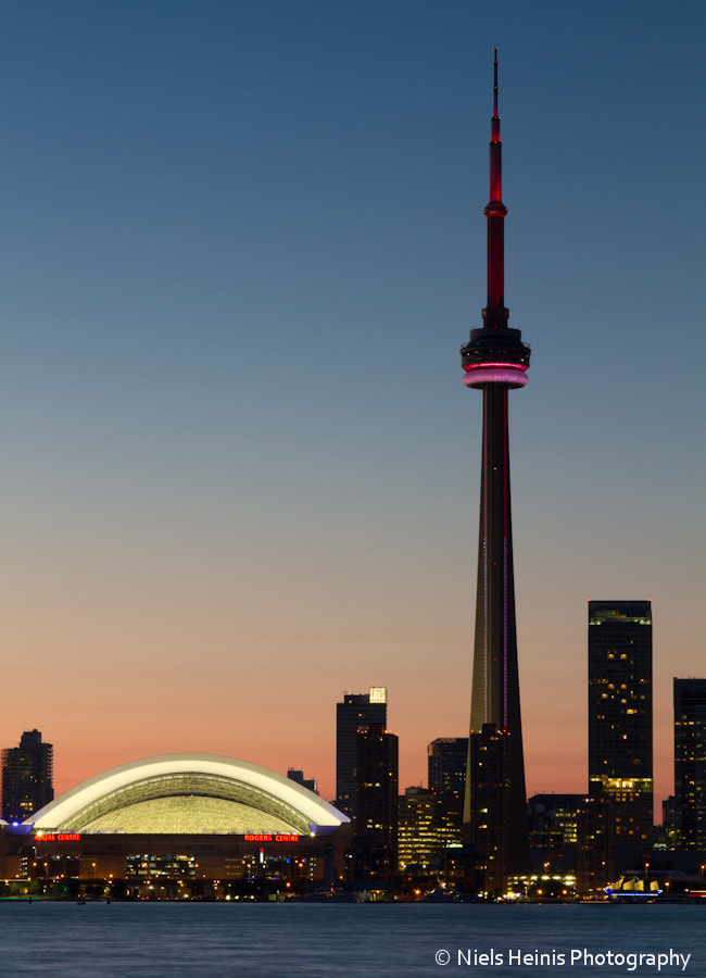 CN Tower rising sky high in Toronto sunset by Niels Heinis / 500px