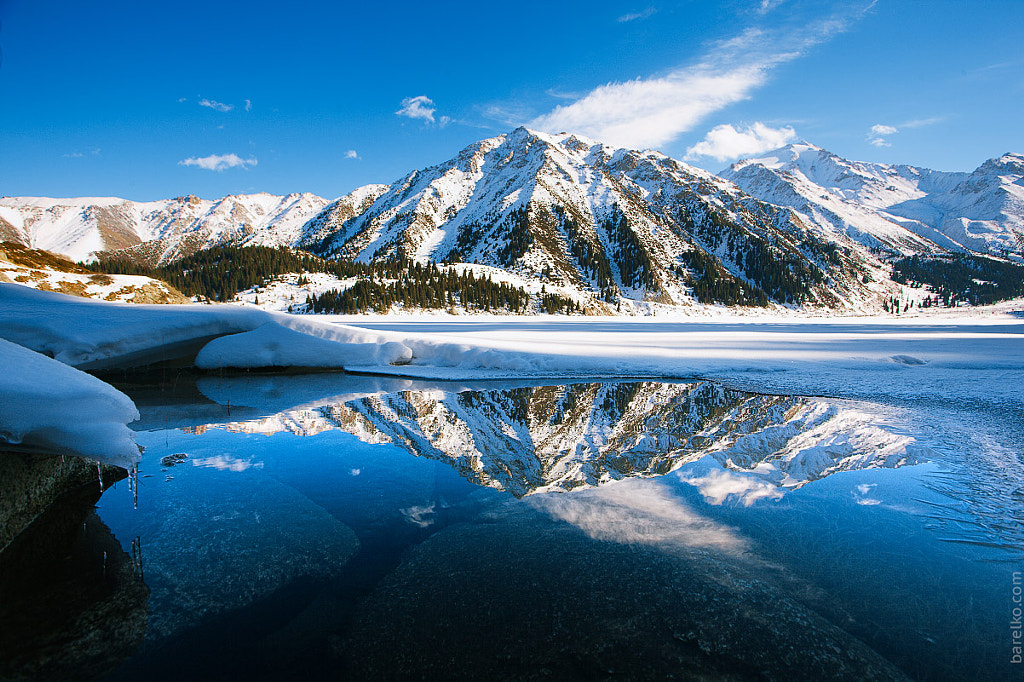 Big Almaty lake on december. Water, ice, mountains and snow. by Roman Barelko on 500px.com