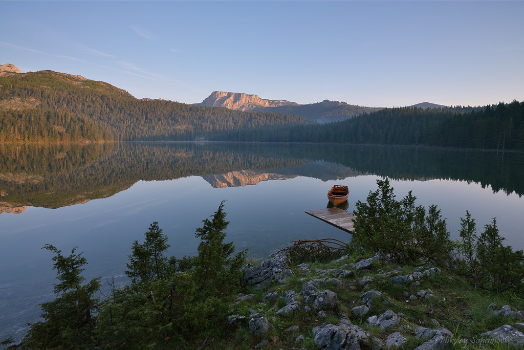 Photograph Calm Morning Reflected in Durmitor Black Lake by Nikolay Sapronov on 500px