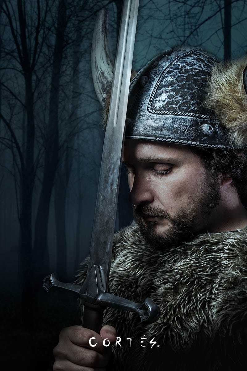 Peace, Viking warrior, male dressed in Barbarian style with swor
