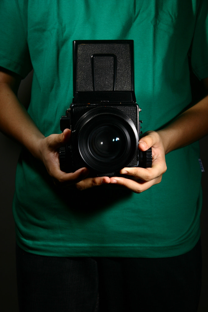 Medium Format camera held by a man by jun pinzon on 500px.com