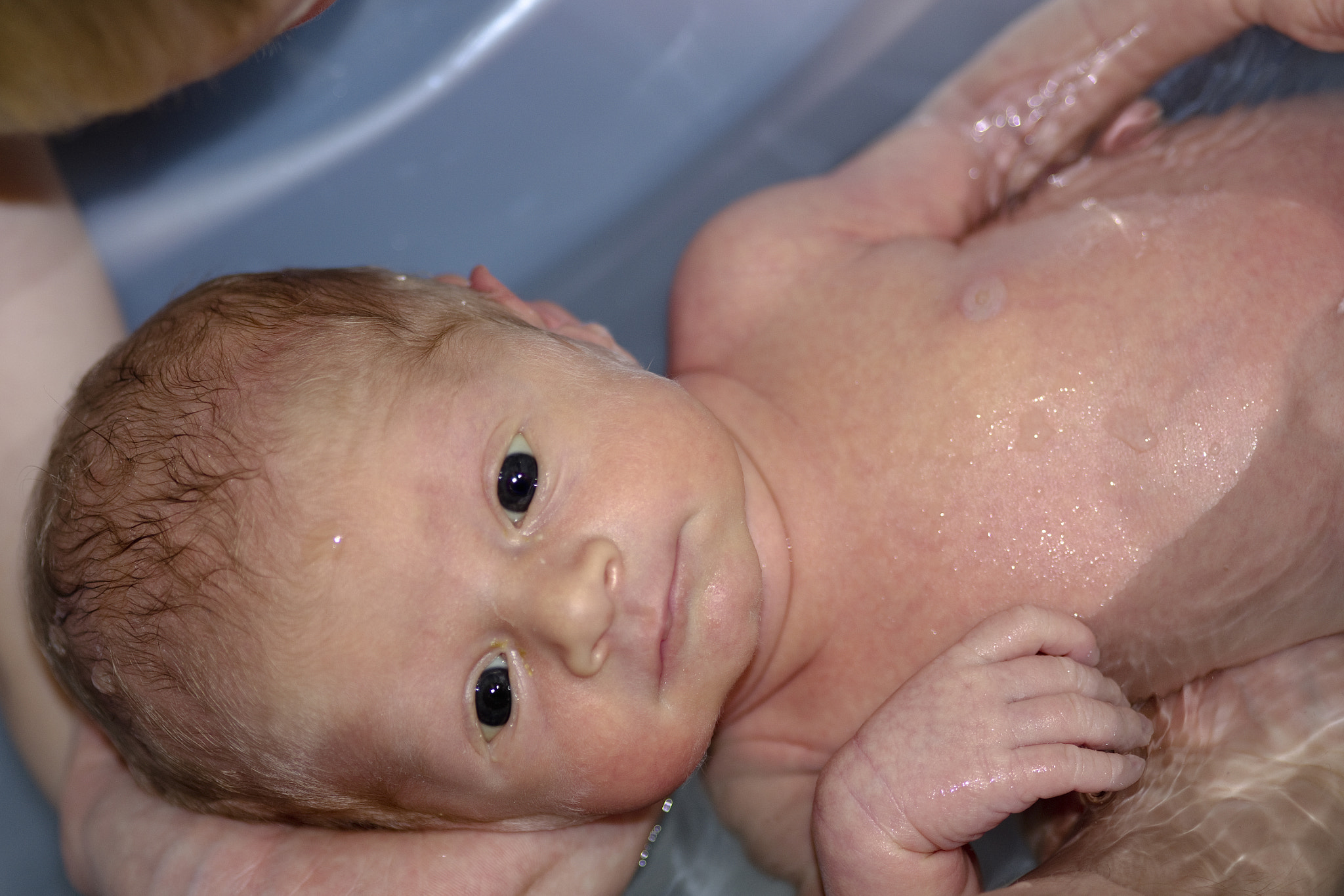 Cute baby boy enjoying bath