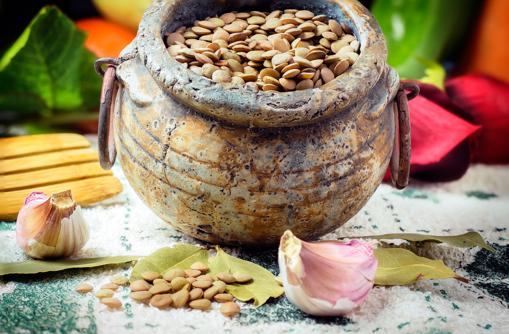 Brown Lentils and bay leaves in old bowl