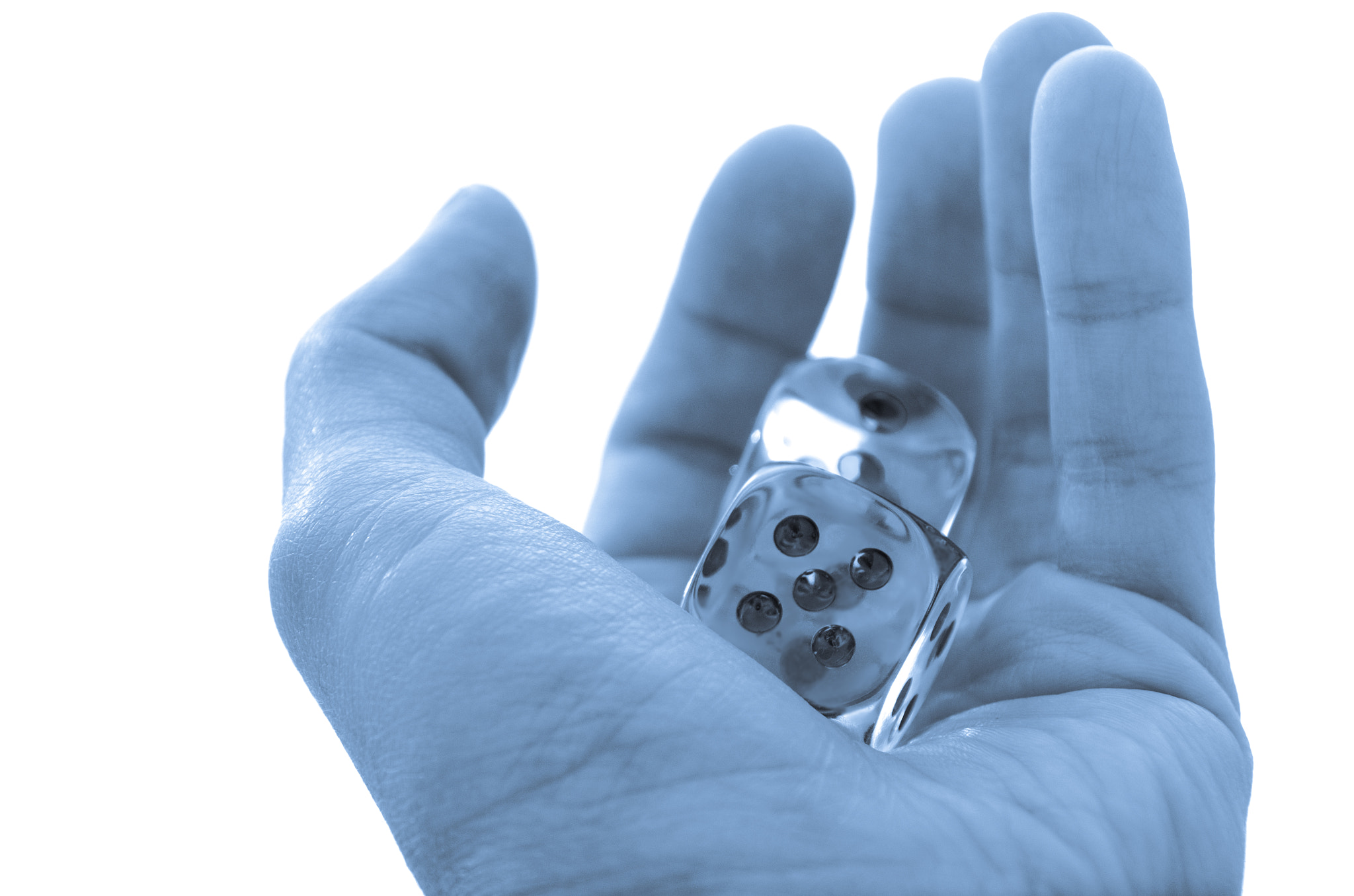 Male hand holding a pair of dice