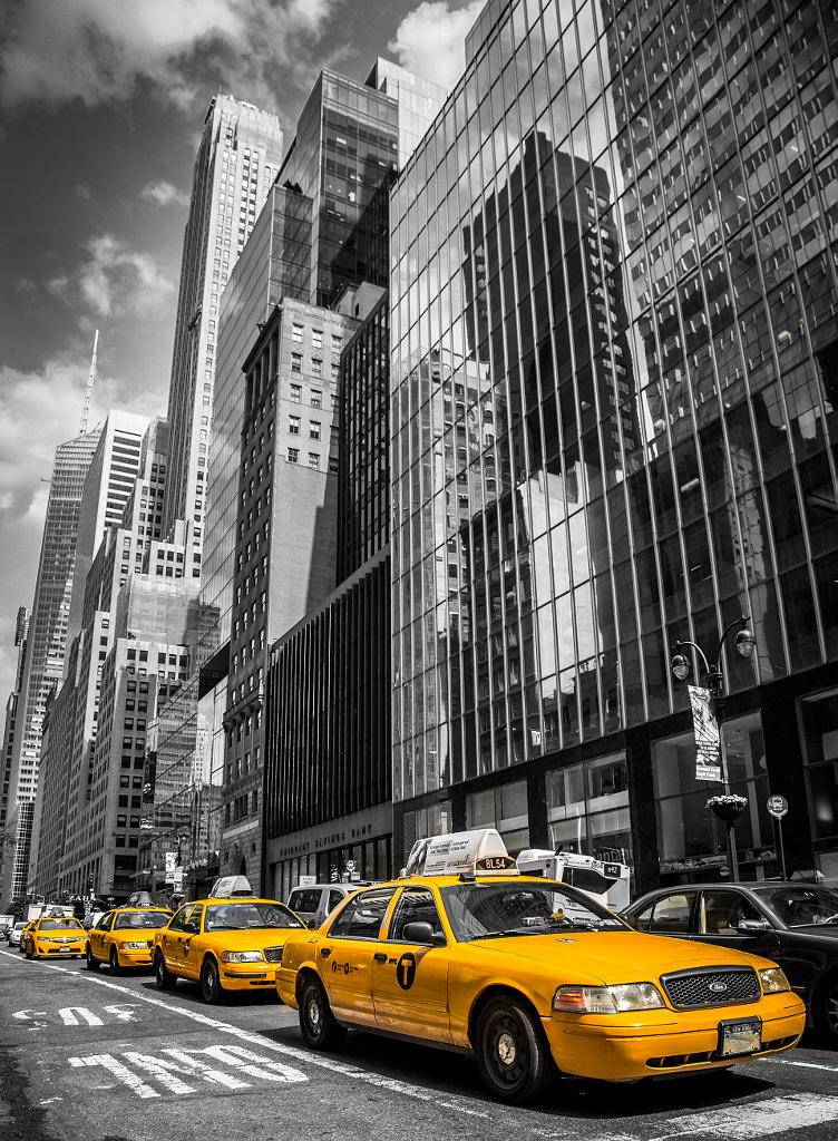 New York - Skyscrapers and Yellow Taxi Cabs by Dan Henson / 500px