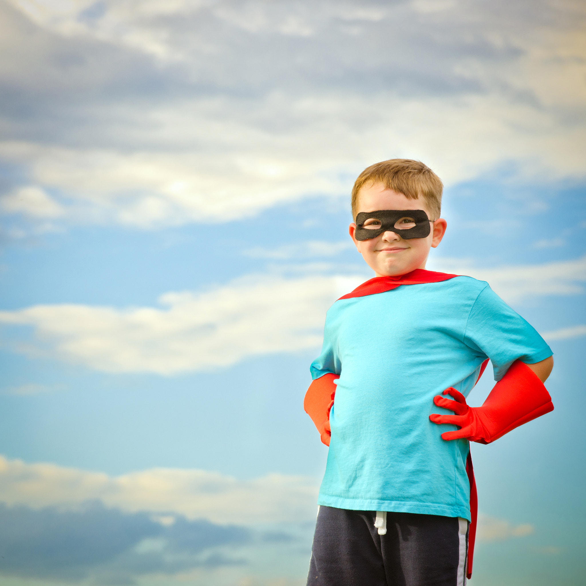 Child pretending to be a superhero