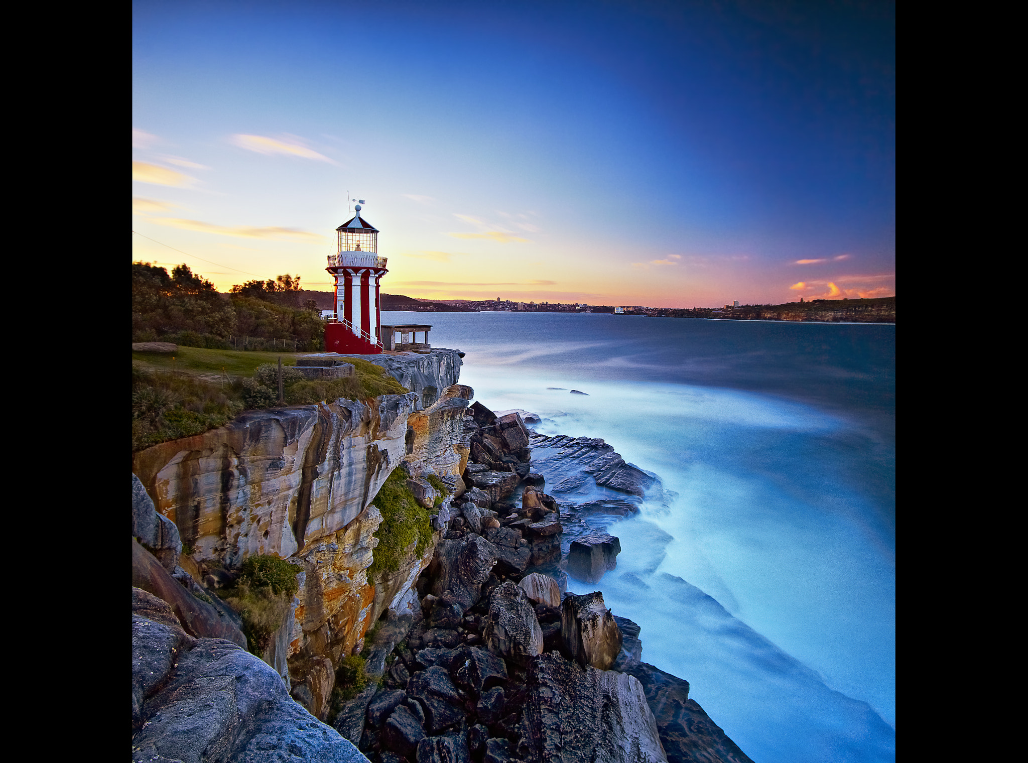 Candy Cane Lighthouse Sunset by Mark Dunham / 500px