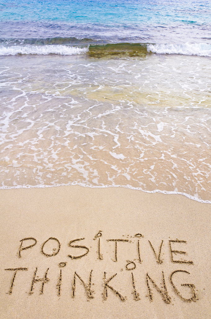 Positive Thinking Message Written On Sand, With Waves In Background By 