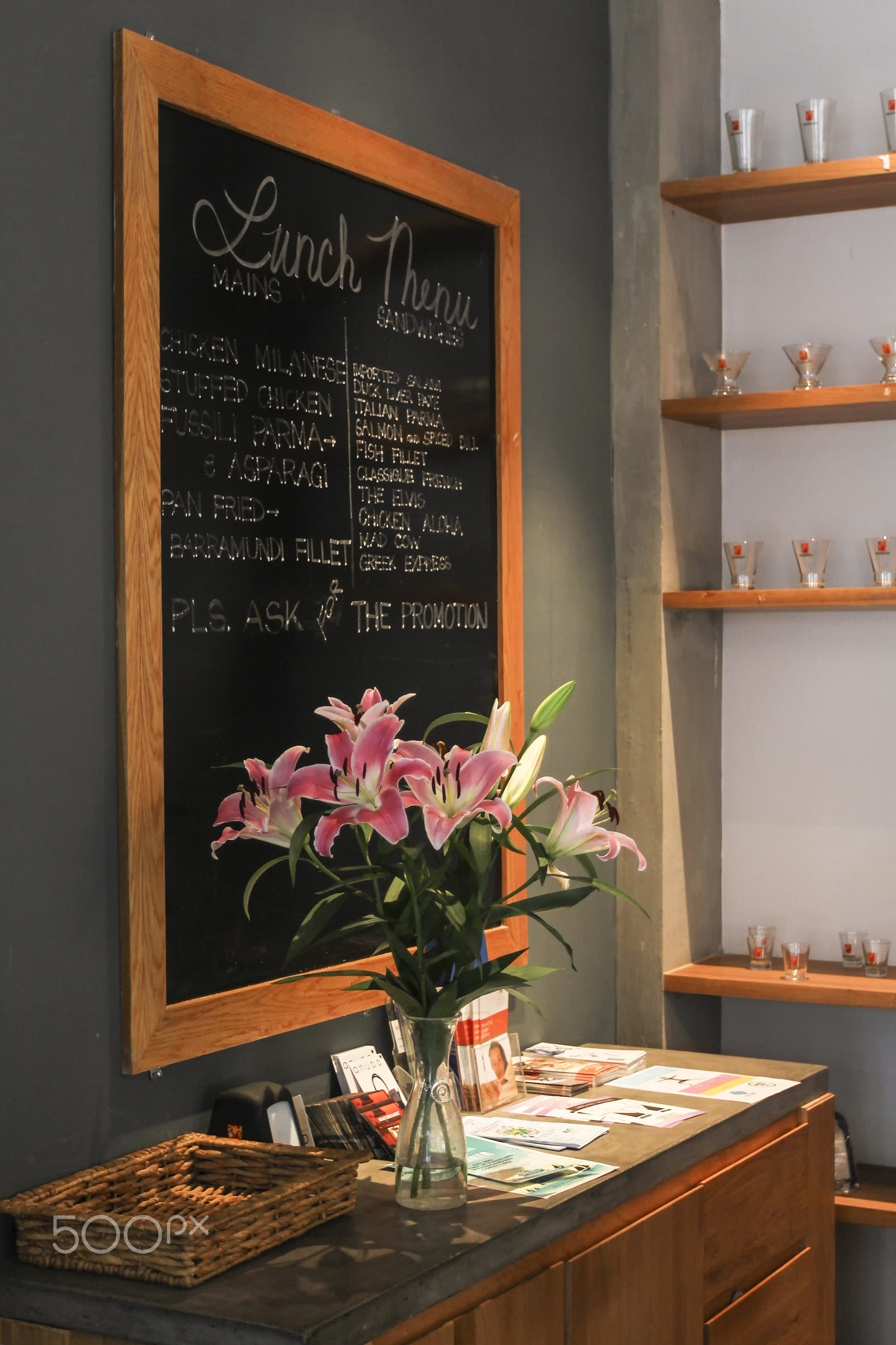 THE CORNER with black board and bottle of flowers