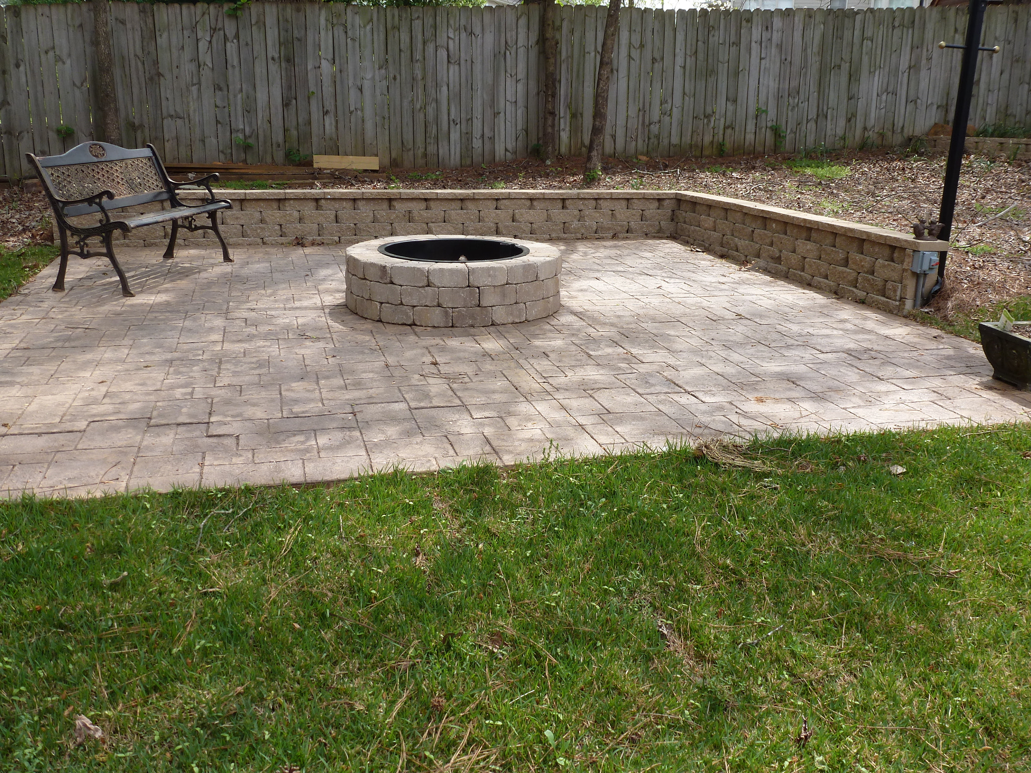 Outdoor Fire Pit & Retaining Wall by Mark Isley Construction Photo