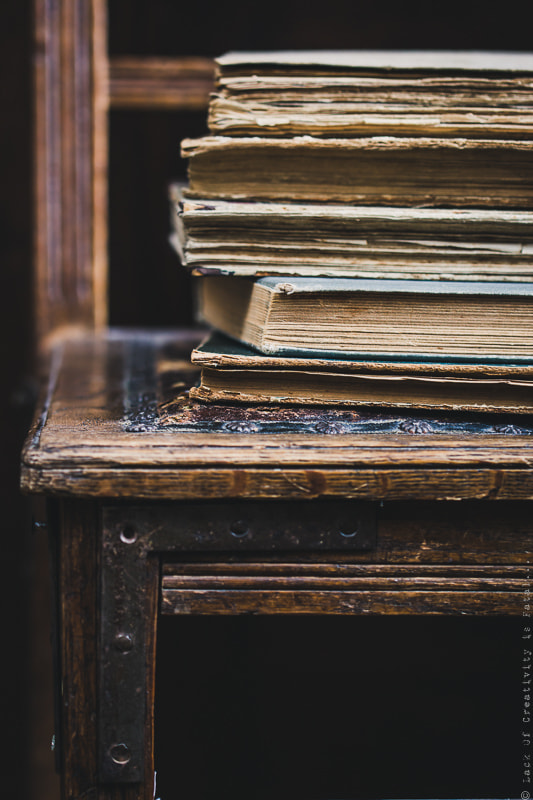 Vintage books on old wooden chair.