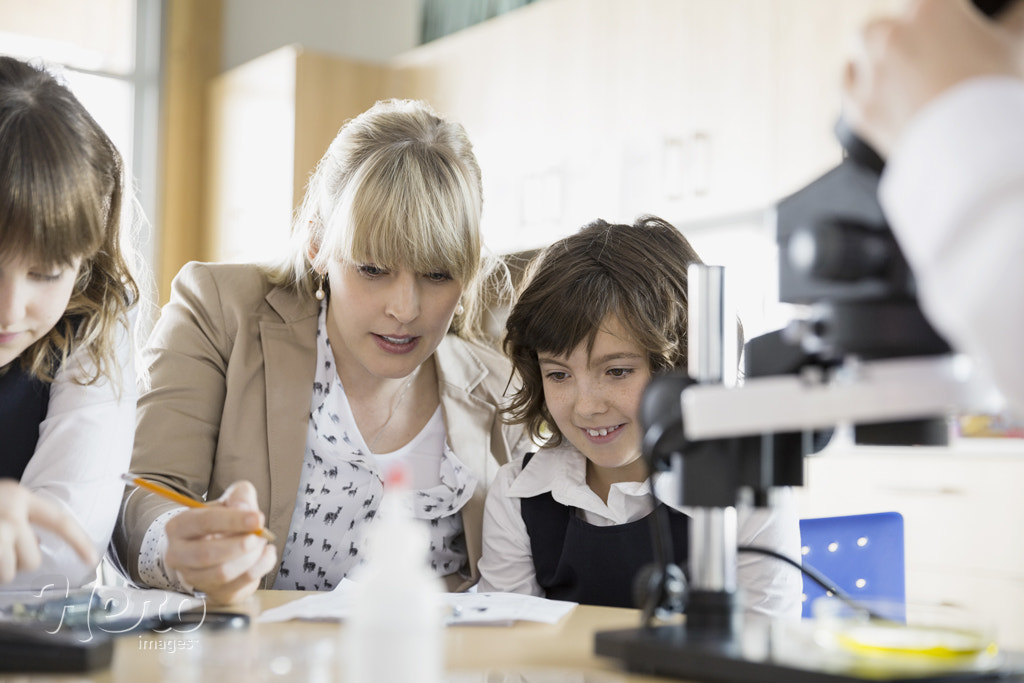 Elementary students and teacher in science classroom