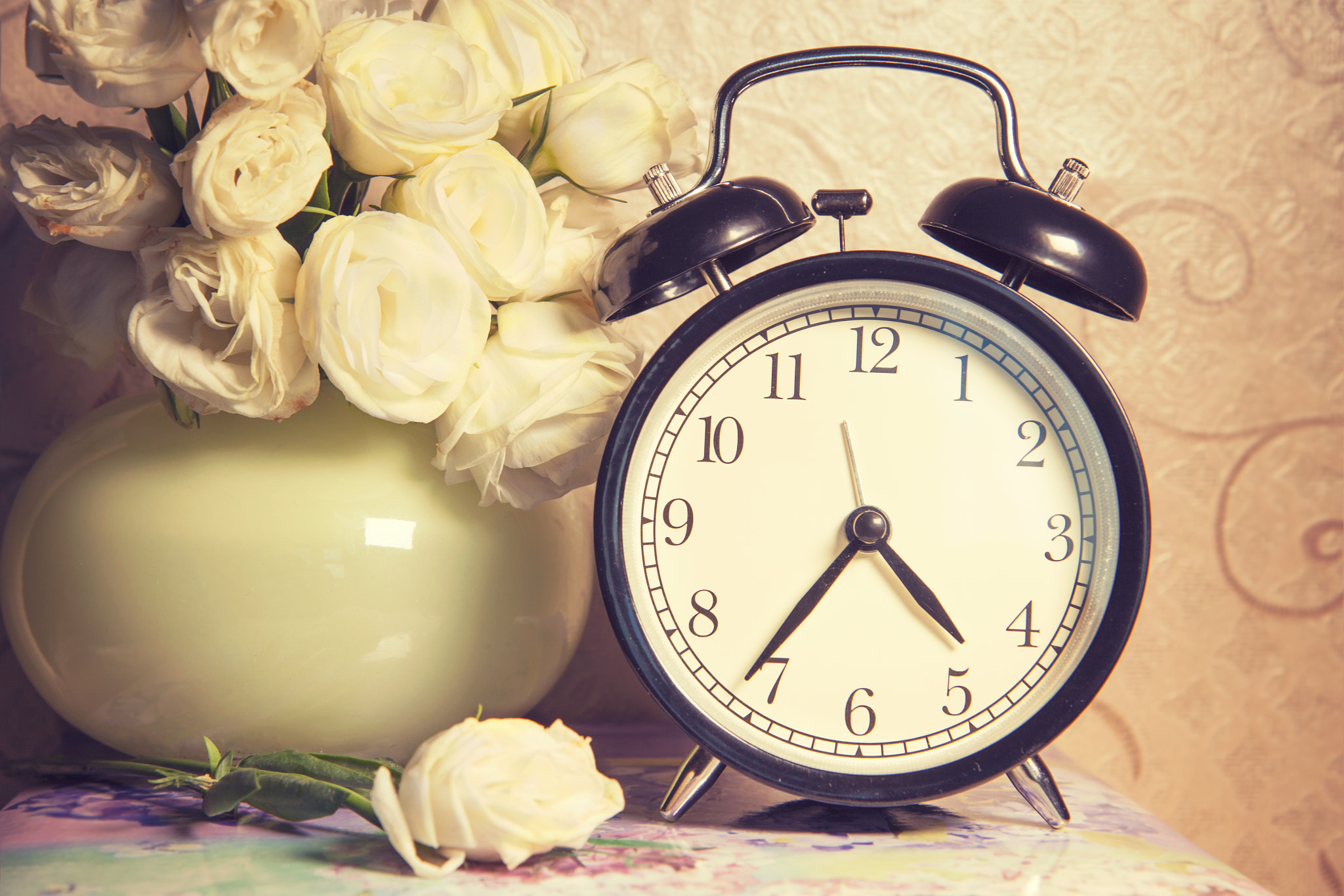 clock ikebana  and vintage on table