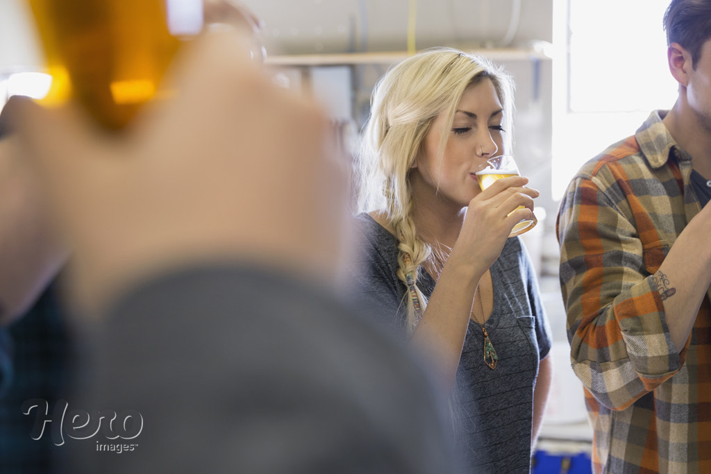 Friends beer tasting at brewery by Hero Images Hero Images on 500px.com