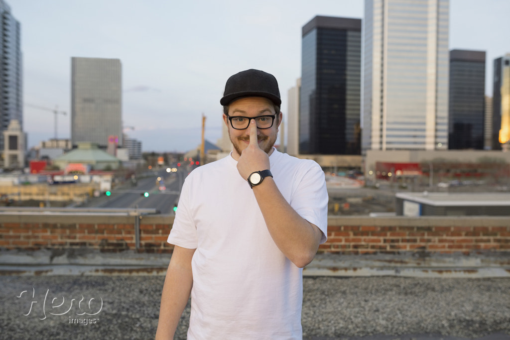 Portrait of man wearing eyeglasses on urban rooftop