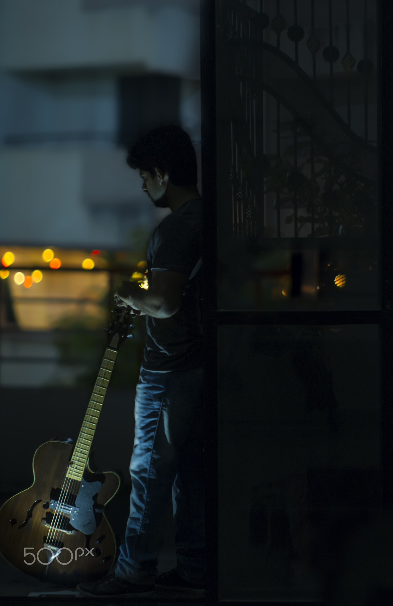 A person holding a guitar