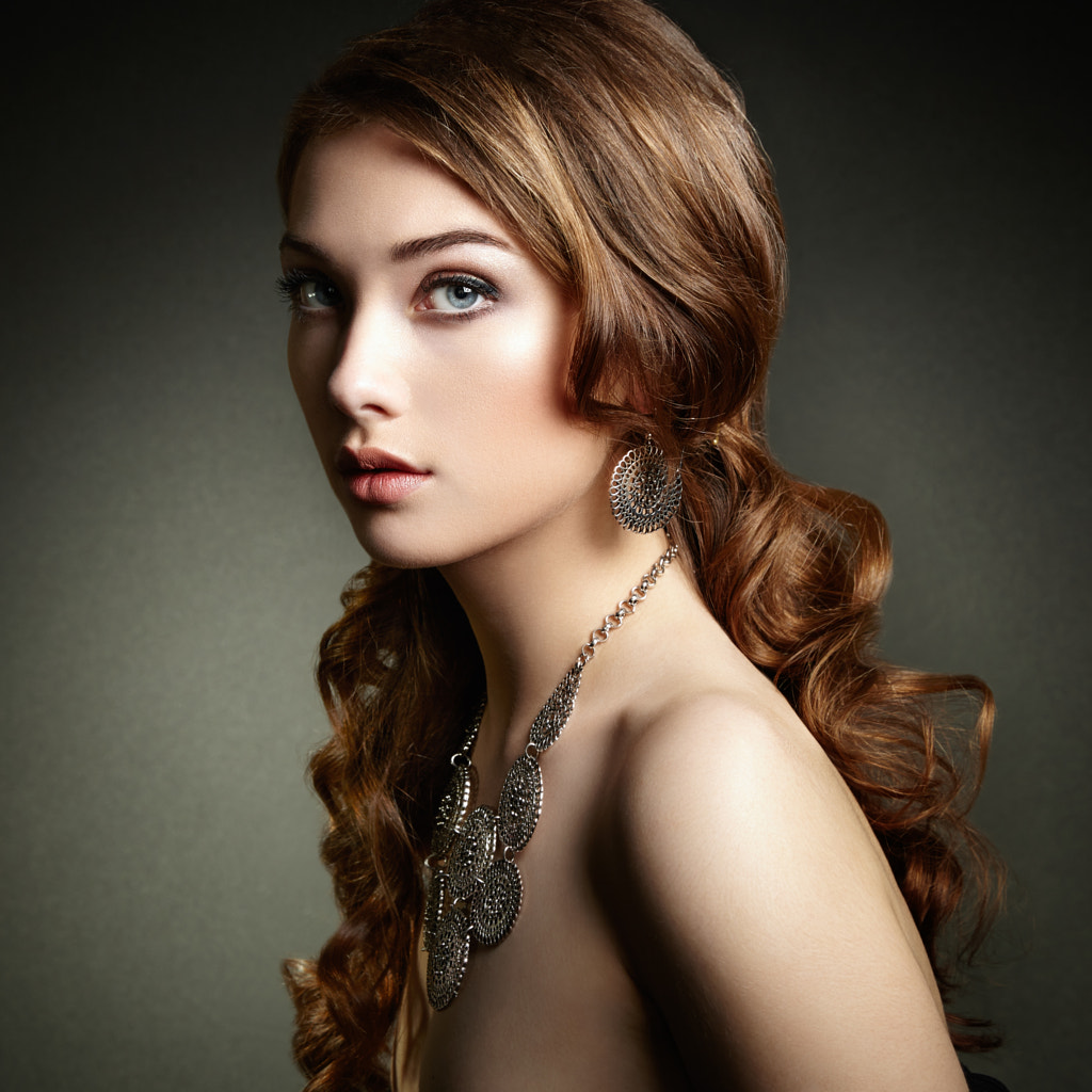 Beauty woman with long curly hair. Beautiful girl with ...